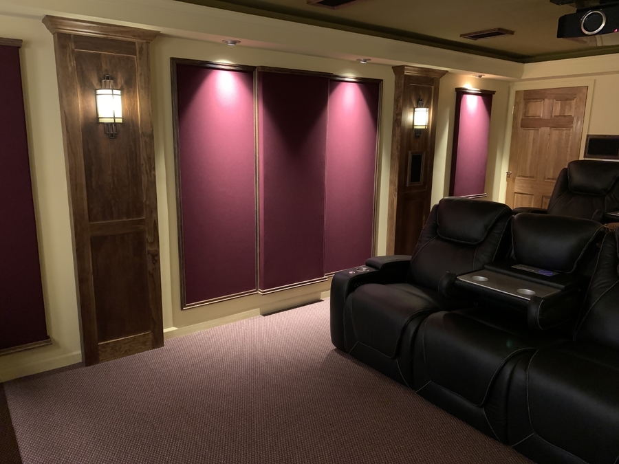 Acoustic panels around the room reduce reflections and improve sound clarity