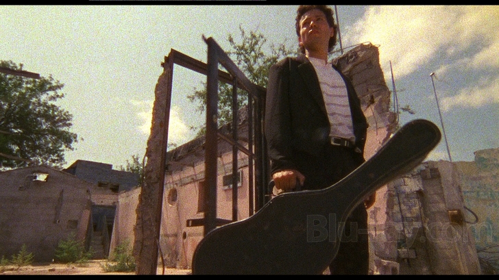 The guitar in the wood of El Mariachi (Antonio Banderas) in